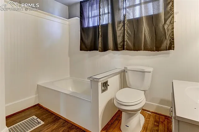 a bathroom with a toilet and a sink