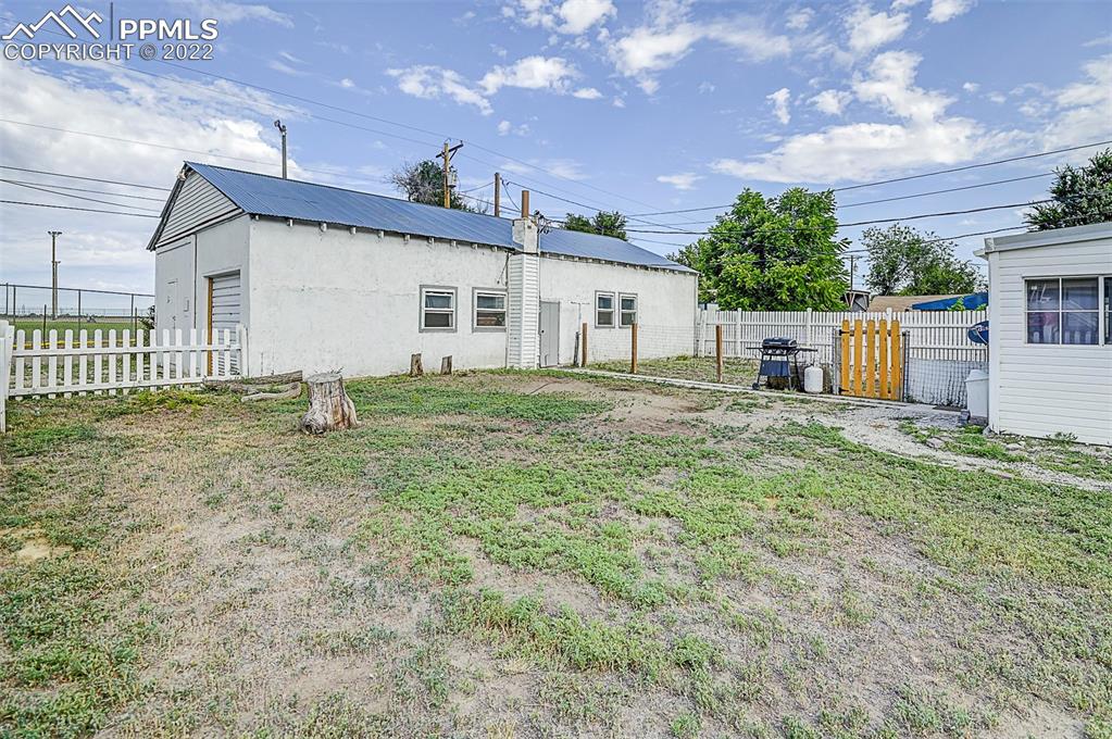312 10th Street Fowler, CO 81039 - Photo 7 of 35 a backyard of a house with table and chairs
