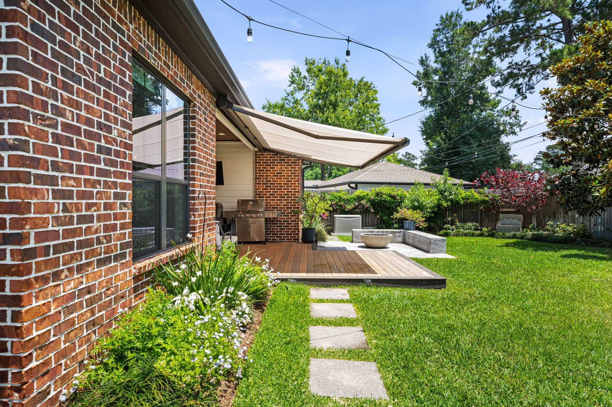 1013 Martin Street Houston, TX 77018 - Photo 42 of 46 Covered patio features an electronic shade system providing additional comfort & functionality for year-round outdoor living & entertaining.