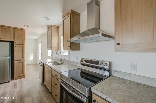 a kitchen with a table chairs refrigerator and microwave