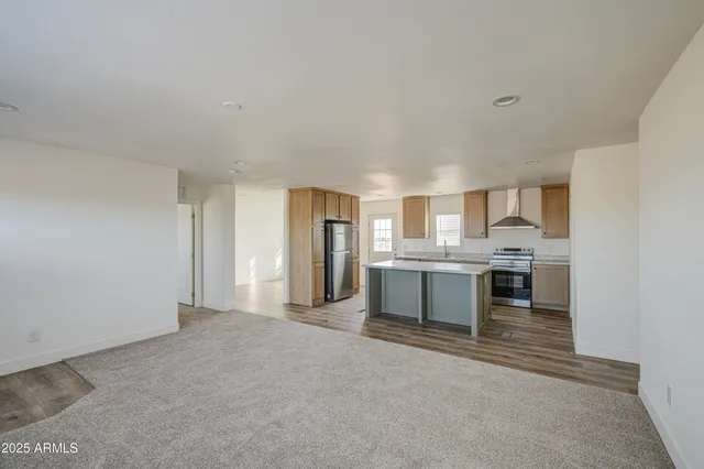 a view of a kitchen with a sink and cabinets