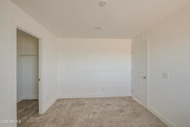 a view of a kitchen with wooden floor and staircase