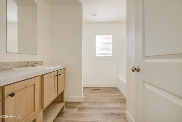 a white bath tub sitting next to a window