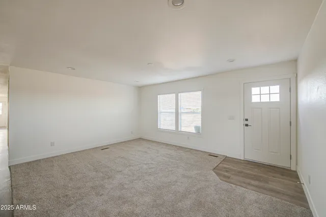 a view of wooden floor and brick walls