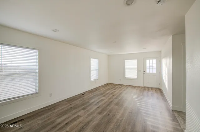a view of an empty room and window
