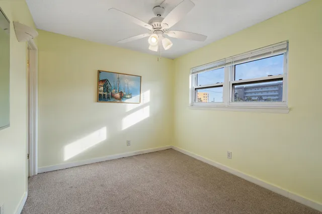 a kitchen with kitchen island granite countertop a sink and a counter top space