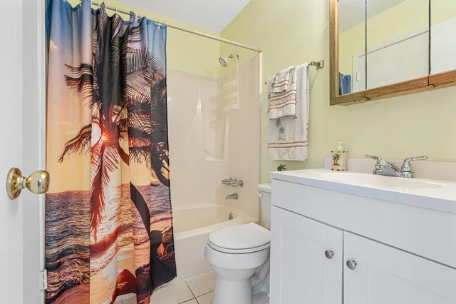 a bedroom with a bed and a view of en suite bathroom