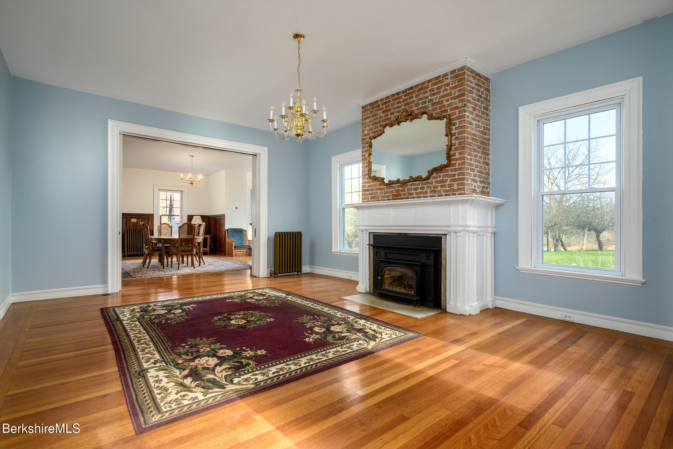 34 Ny Route Petersburg, NY 12138 - Photo 36 of 59 a living room with a fireplace windows and a rug