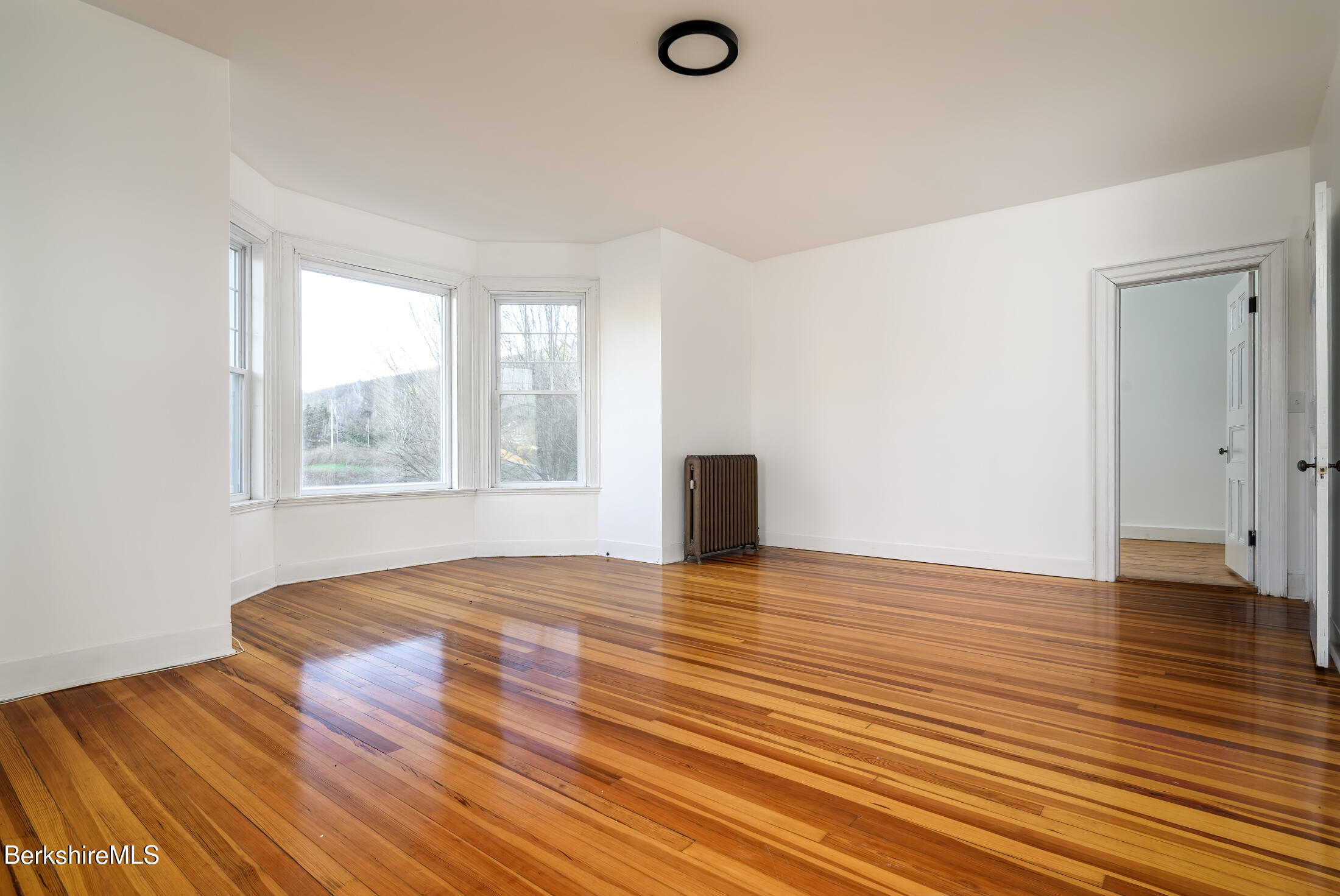 34 Ny Route Petersburg, NY 12138 - Photo 43 of 59 a view of an empty room with wooden floor and a window