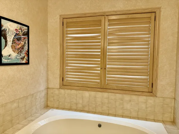 a room with a table and stairs