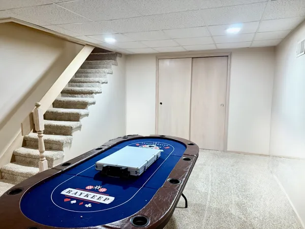 a living room with furniture and kitchen view