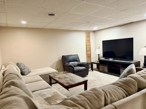 a living room with furniture and a couch