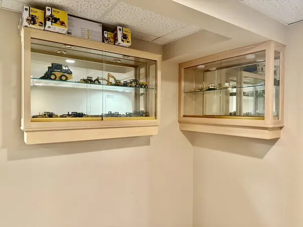 a white toilet sitting next to a bathroom sink