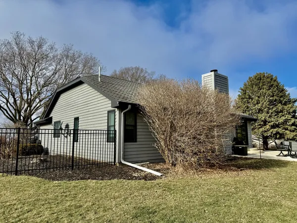 a view of swimming pool with chairs