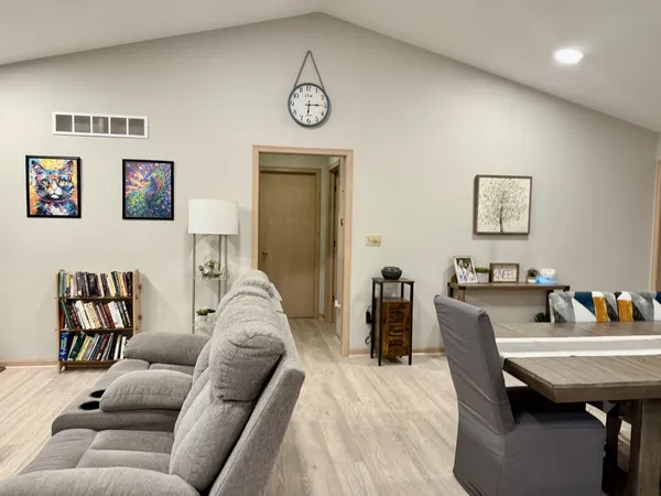 a living room with furniture and a table