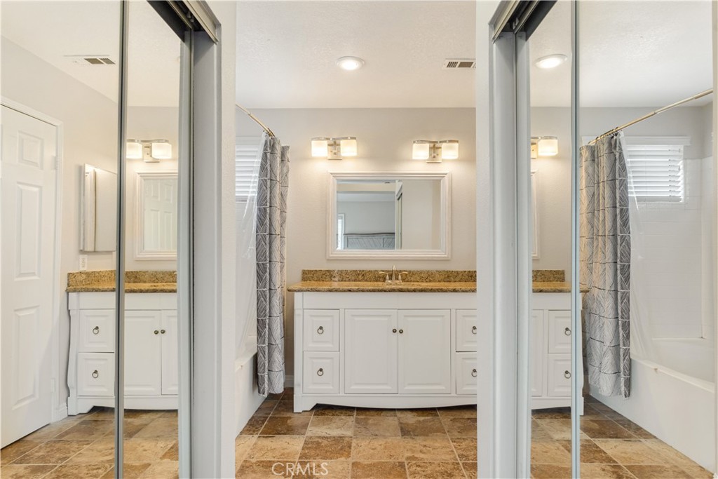 934 Mission Grove Riverside, CA 92506 - Photo 20 of 28 a bathroom with a glass shower door and a sink
