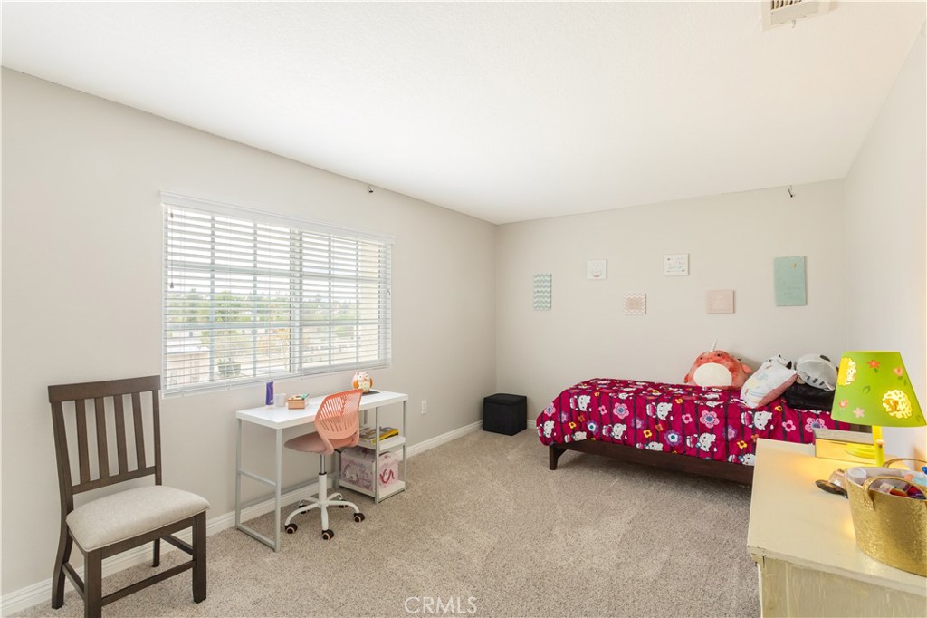 934 Mission Grove Riverside, CA 92506 - Photo 21 of 28 a bedroom with furniture and a window