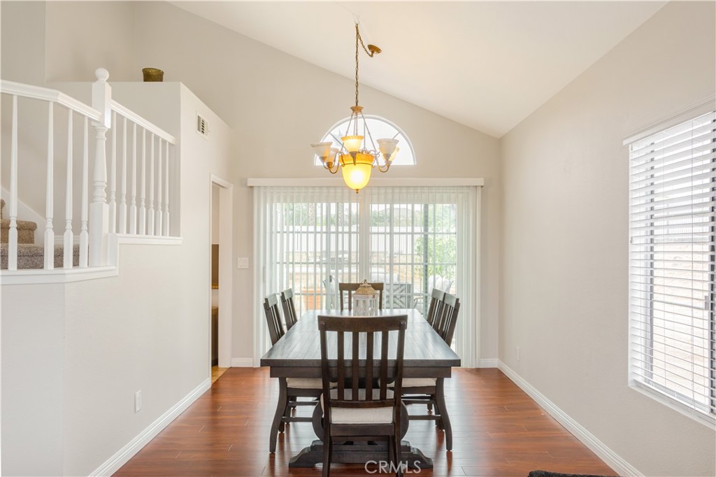 934 Mission Grove Riverside, CA 92506 - Photo 6 of 28 a view of a dining room with furniture a chandelier and wooden floor