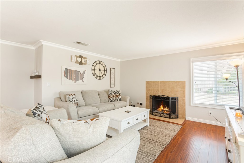934 Mission Grove Riverside, CA 92506 - Photo 9 of 28 a living room with furniture and a fireplace