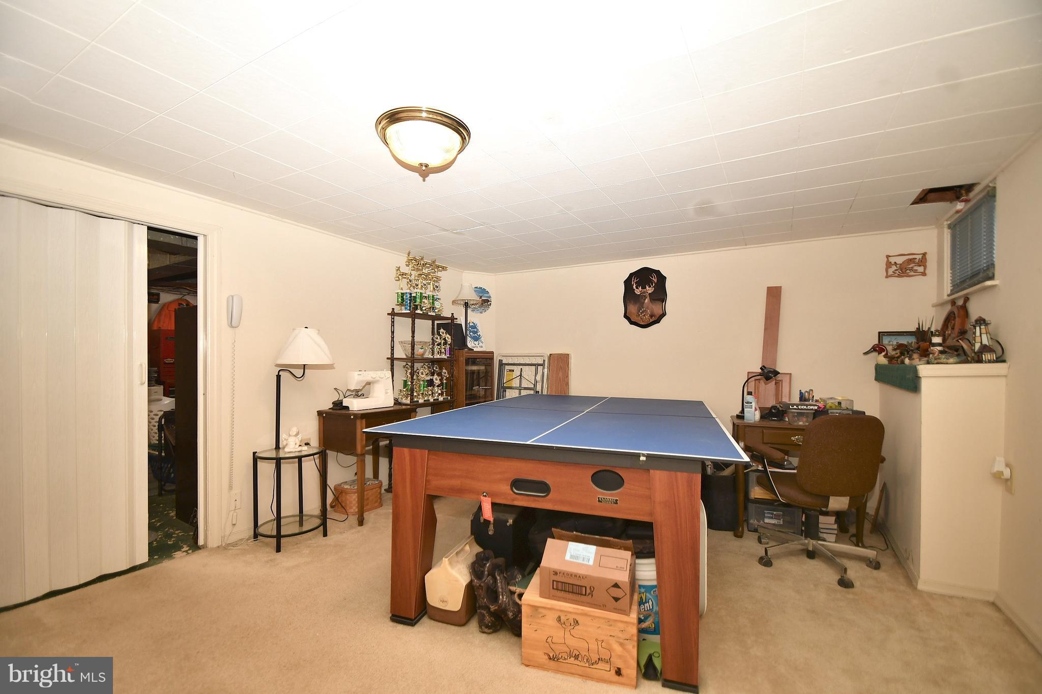 25 Cardinal Road Baltimore, MD 21221 - Photo 20 of 28 Basement recreation room w/adjacent workshop