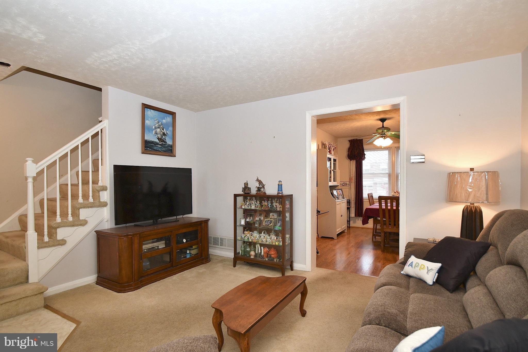 Living Room w/access to dining and upper level