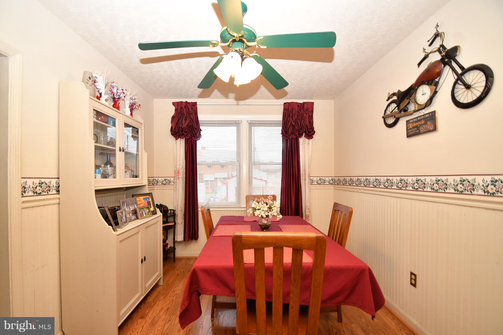 25 Cardinal Road Baltimore, MD 21221 - Photo 9 of 28 Dining Room w/ hardwood laminate flooring
