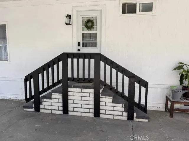 a view of room with wooden floor and window