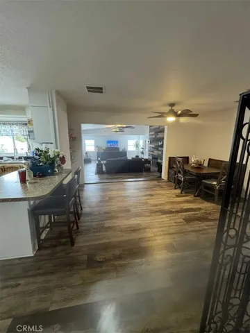 a room with wooden floor and furniture