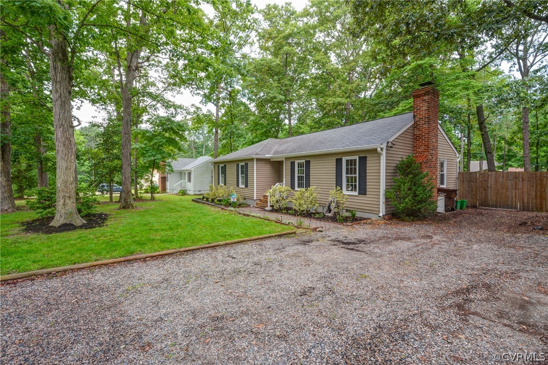4906 Rollingway Road Chesterfield, VA 23832 - Photo 1 of 34 a view of outdoor space and garden