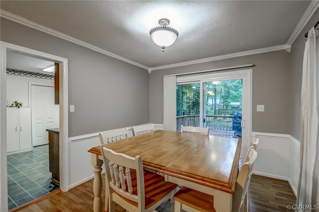 4906 Rollingway Road Chesterfield, VA 23832 - Photo 11 of 34 a dining room with a table and chairs