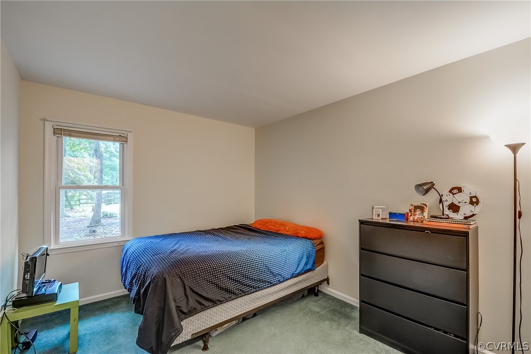4906 Rollingway Road Chesterfield, VA 23832 - Photo 16 of 34 a bedroom with a bed and a window
