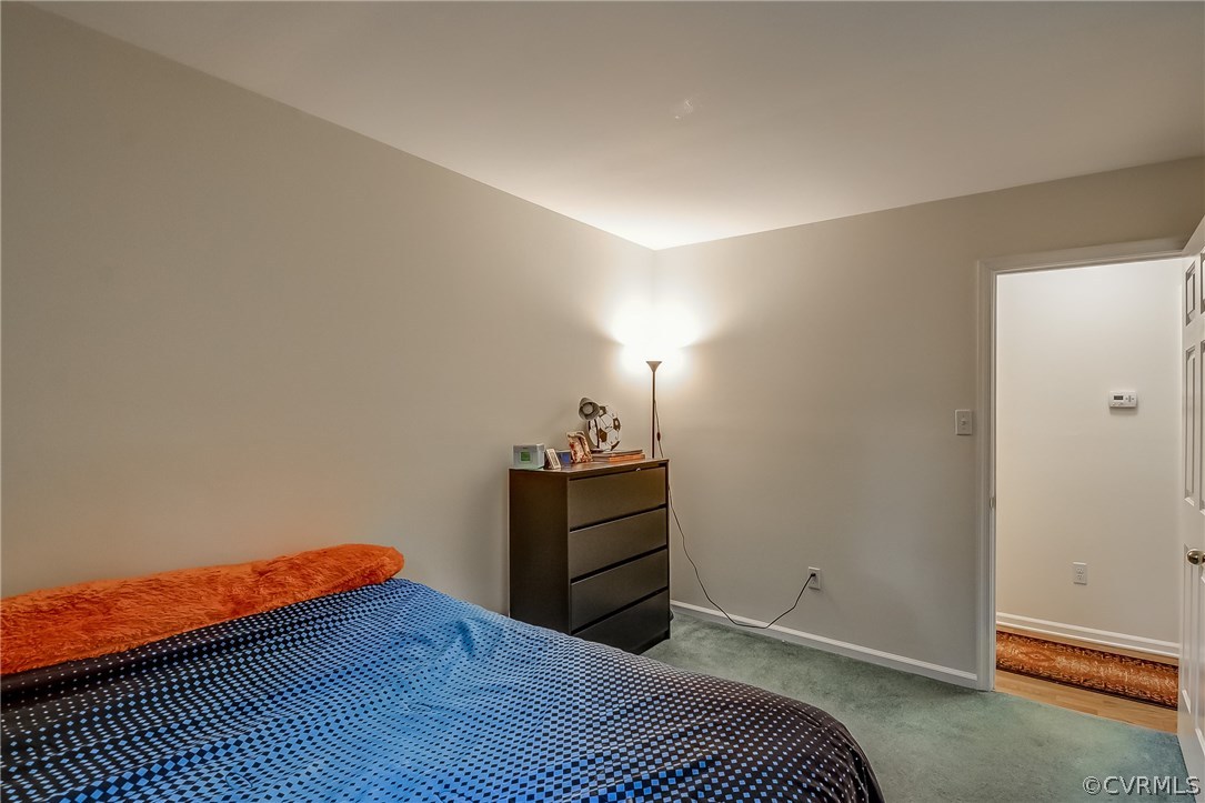 4906 Rollingway Road Chesterfield, VA 23832 - Photo 18 of 34 a bedroom with a bed and cabinet
