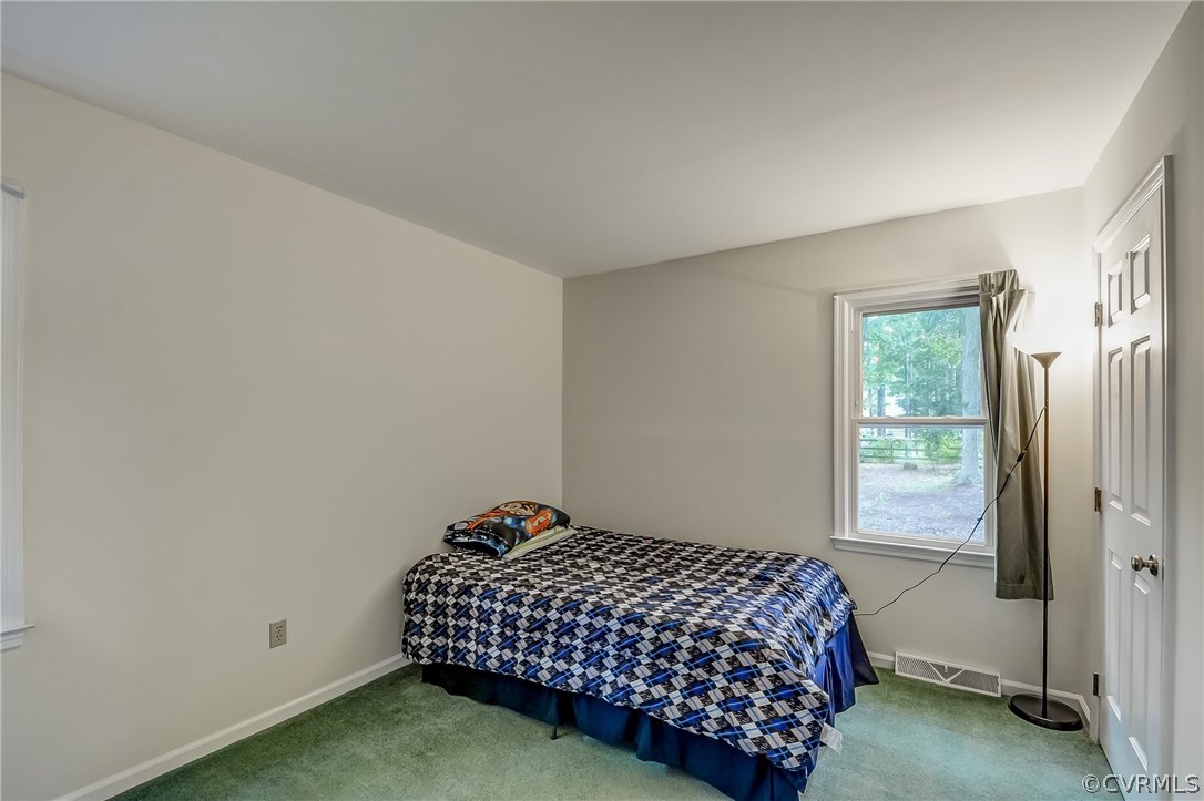 4906 Rollingway Road Chesterfield, VA 23832 - Photo 19 of 34 a bedroom with a bed and a window