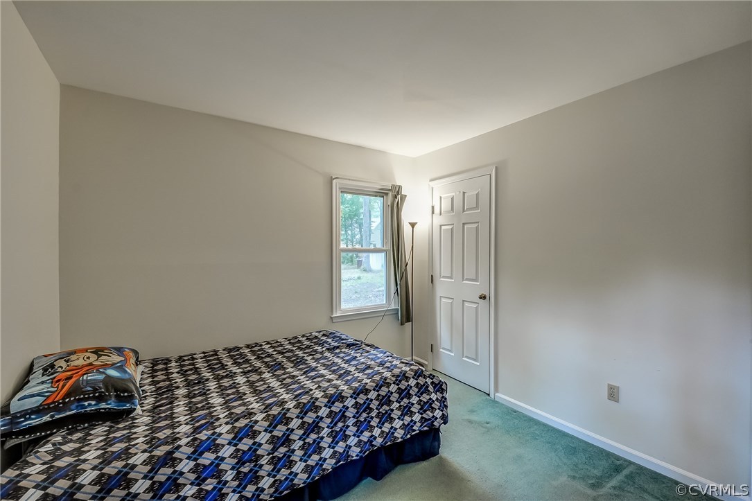 4906 Rollingway Road Chesterfield, VA 23832 - Photo 20 of 34 a bedroom with a bed and a window