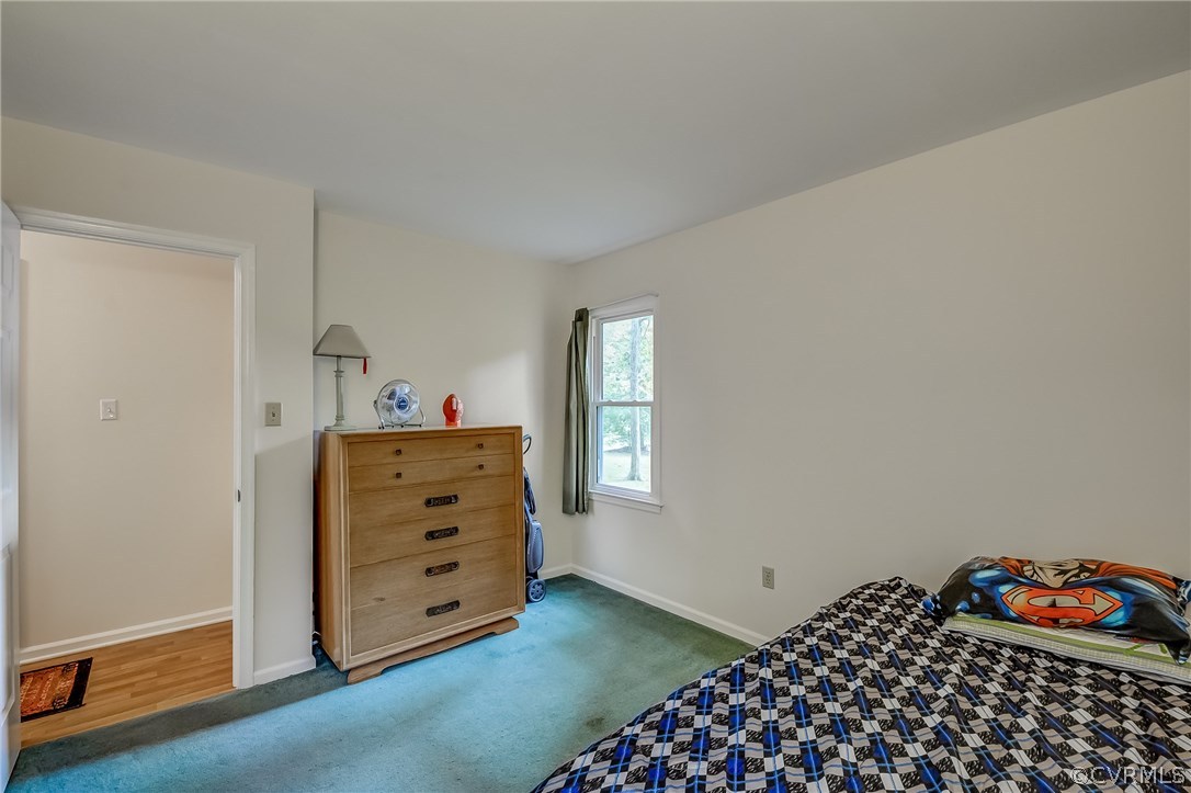 4906 Rollingway Road Chesterfield, VA 23832 - Photo 21 of 34 a bedroom with a dresser and a window
