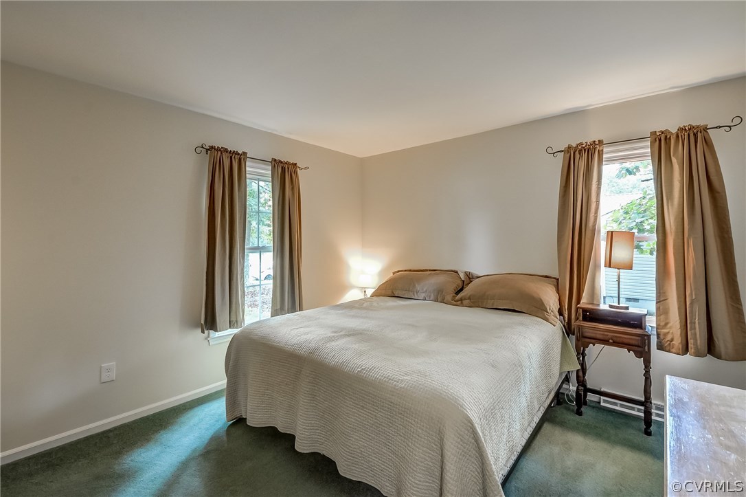 4906 Rollingway Road Chesterfield, VA 23832 - Photo 25 of 34 a bedroom with a bed lamp and a large window