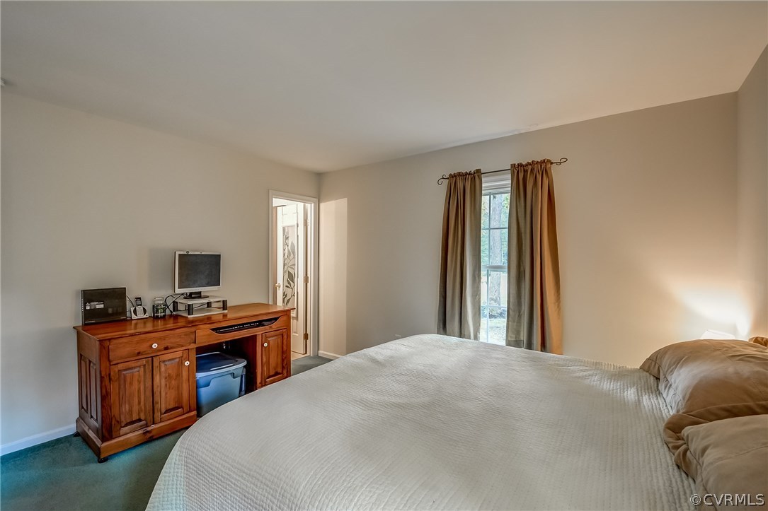 4906 Rollingway Road Chesterfield, VA 23832 - Photo 26 of 34 a bedroom with a bed and a desk