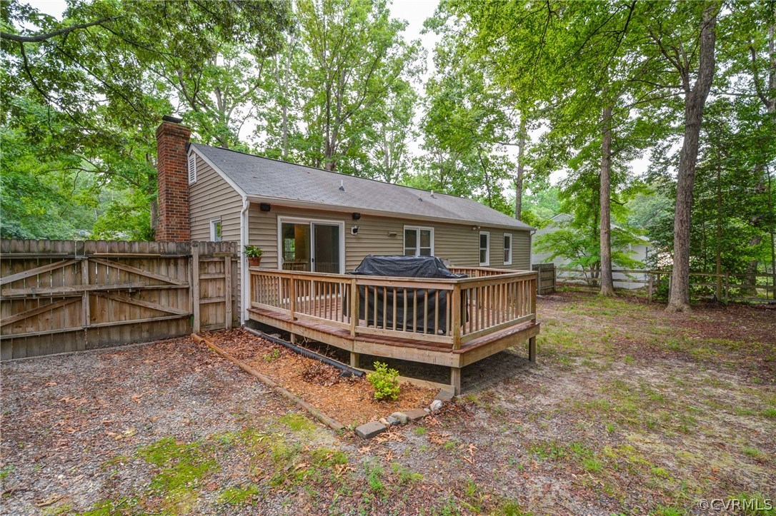 4906 Rollingway Road Chesterfield, VA 23832 - Photo 32 of 34 a view of a house with a backyard and deck