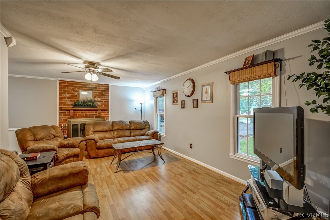 4906 Rollingway Road Chesterfield, VA 23832 - Photo 4 of 34 a living room with furniture and wooden floor