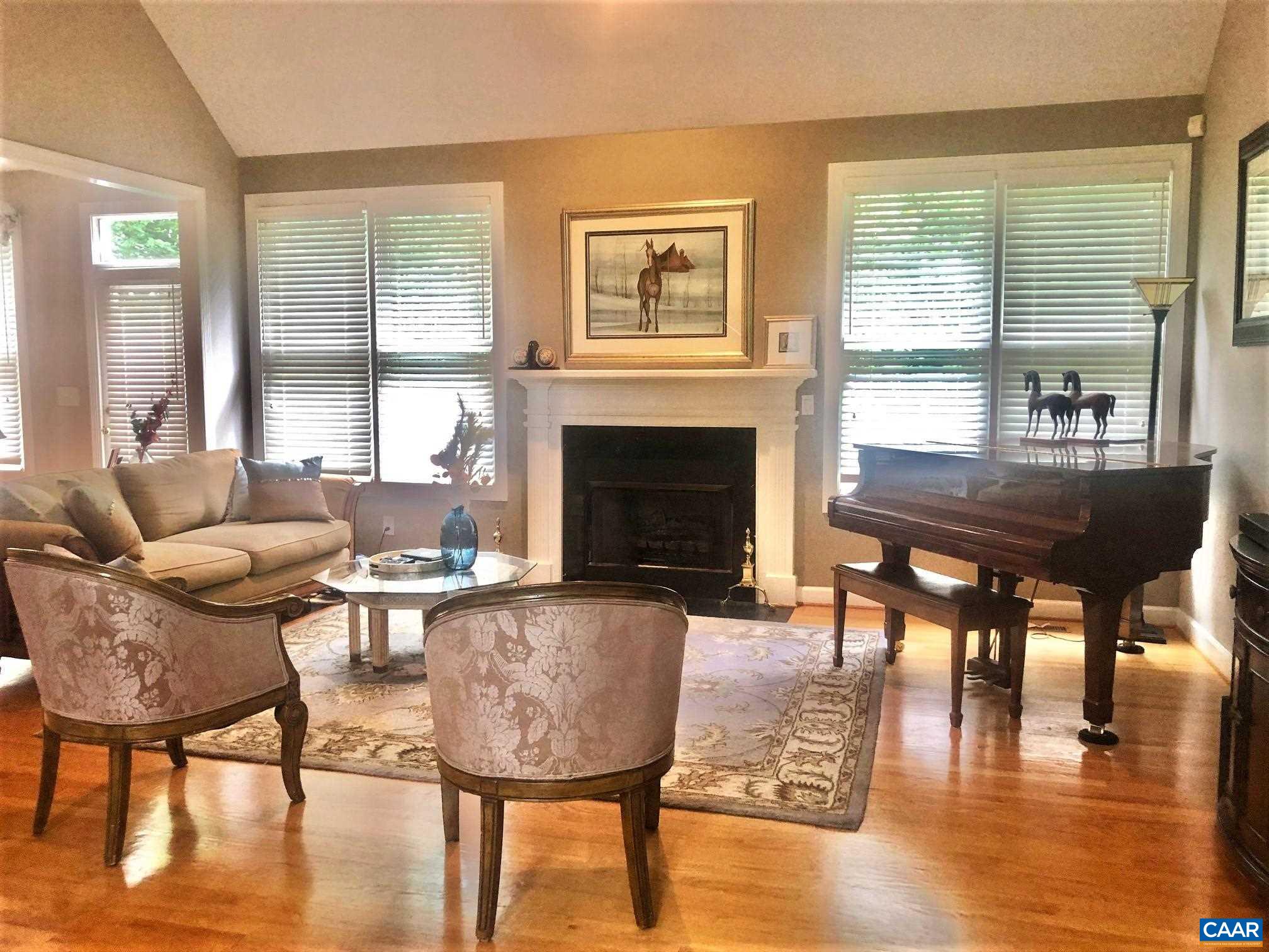 3 Old Farm Road Charlottesville, VA 22903 - Photo 18 of 66 a living room with furniture and a fireplace