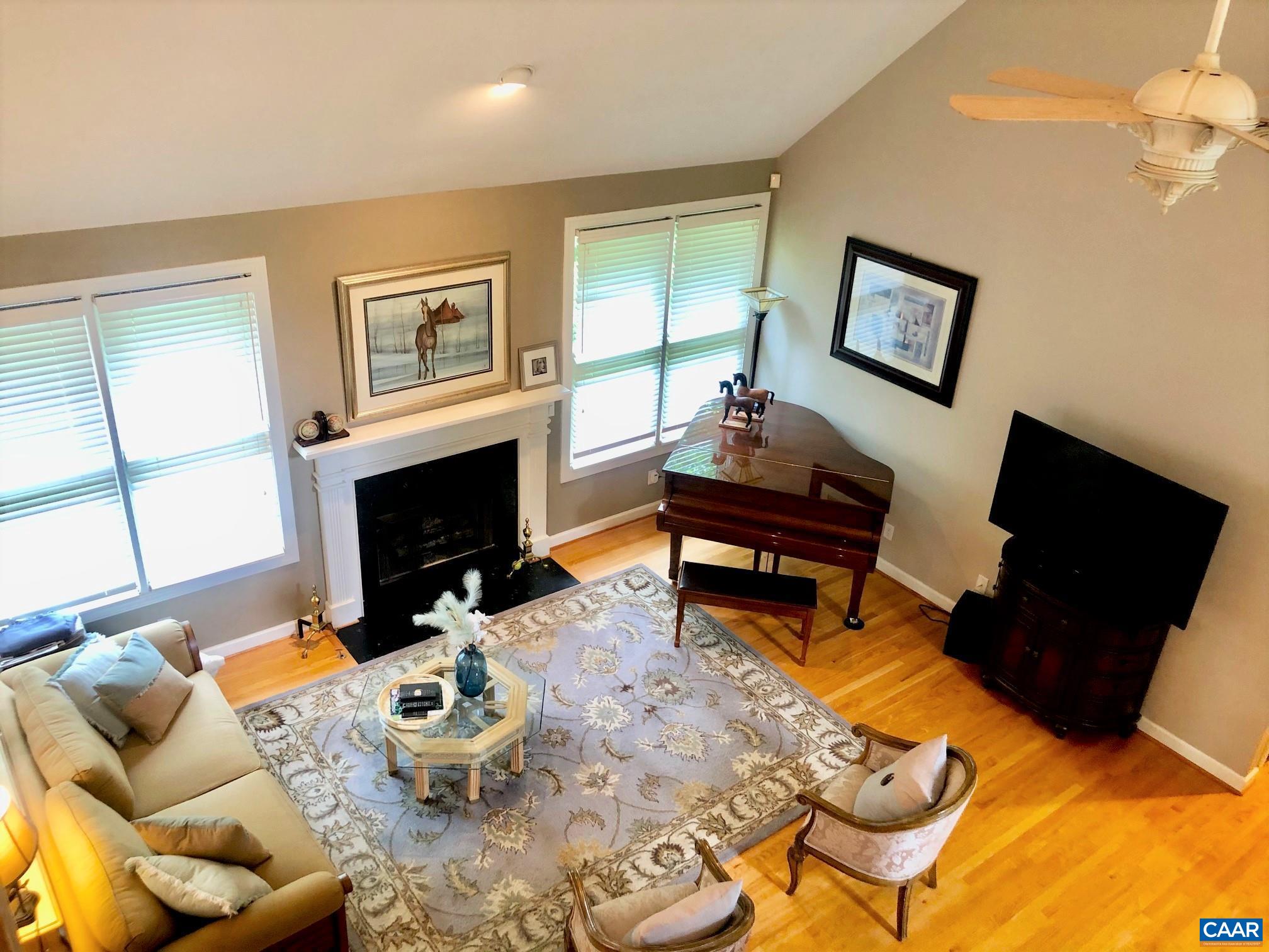 3 Old Farm Road Charlottesville, VA 22903 - Photo 19 of 66 a living room with furniture fireplace and a flat screen tv