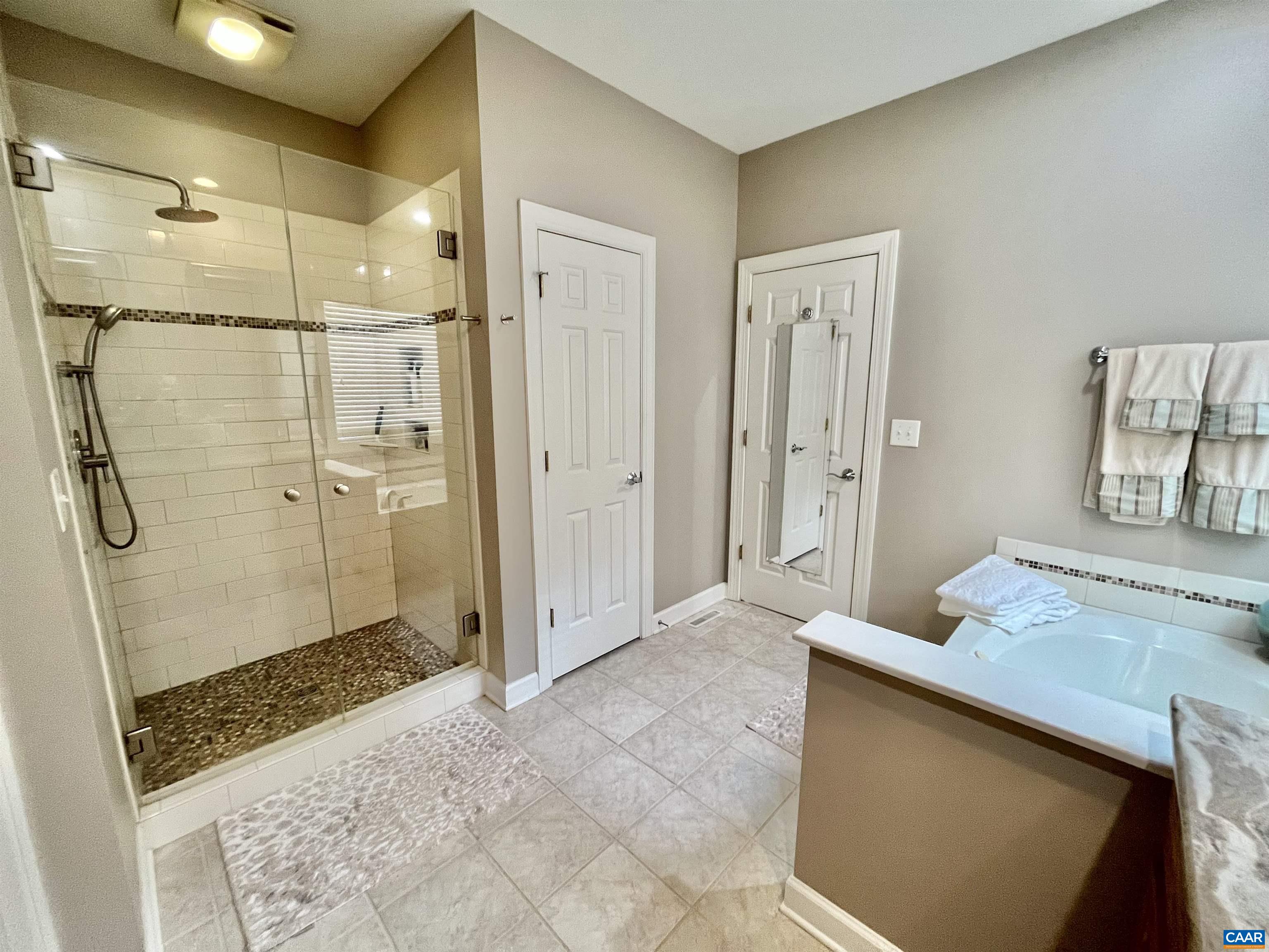 3 Old Farm Road Charlottesville, VA 22903 - Photo 24 of 66 a bathroom with a granite countertop sink a shower and