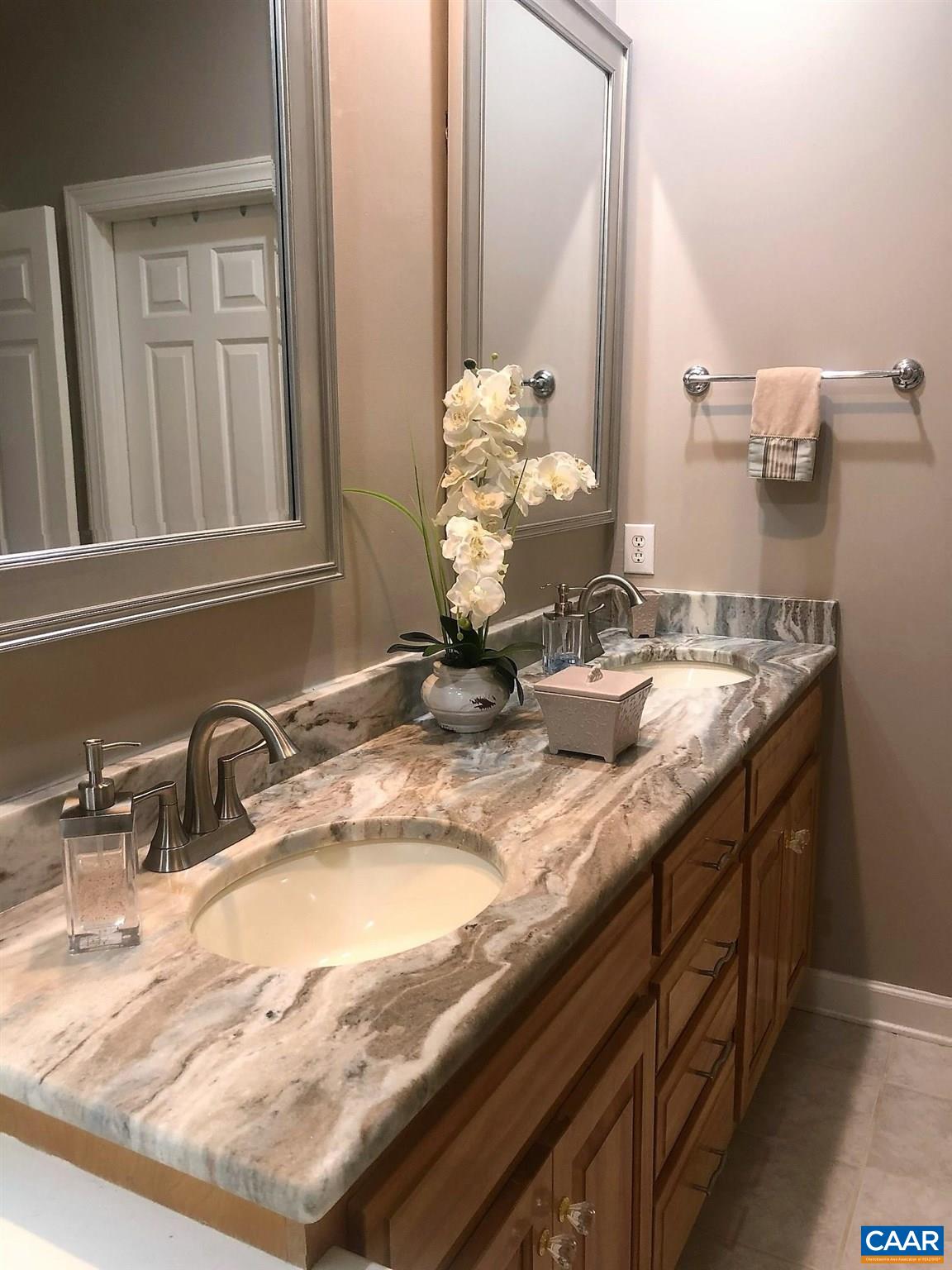 3 Old Farm Road Charlottesville, VA 22903 - Photo 27 of 66 a bathroom with a granite countertop sink and a mirror