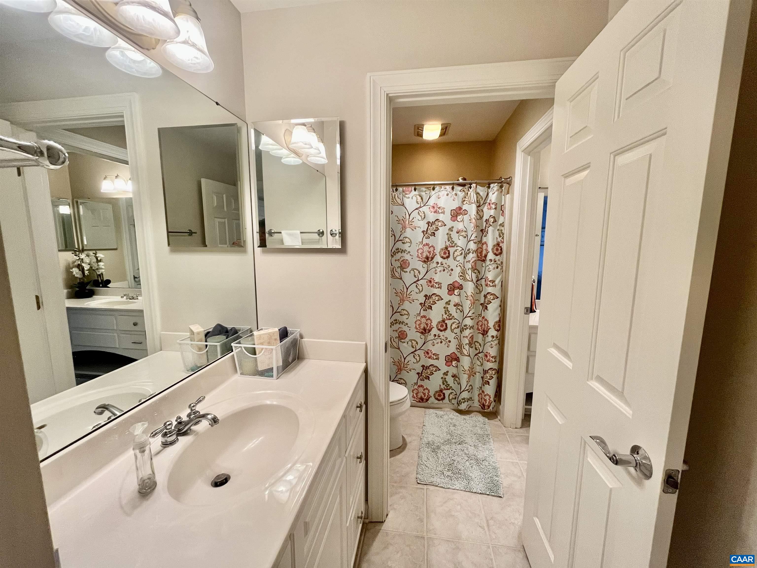 3 Old Farm Road Charlottesville, VA 22903 - Photo 41 of 66 a bathroom with a sink a mirror a vanity and shower