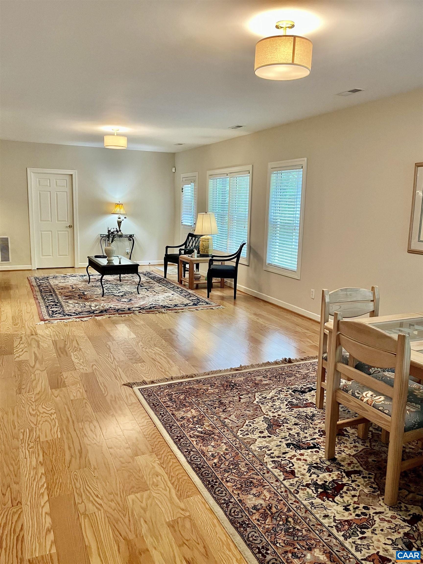 3 Old Farm Road Charlottesville, VA 22903 - Photo 44 of 66 a living room with couches rug and a dining table