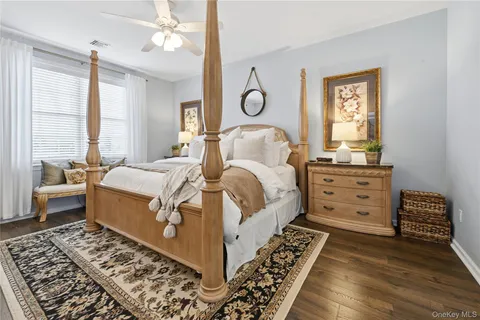 a bathroom with a sink mirror and toilet