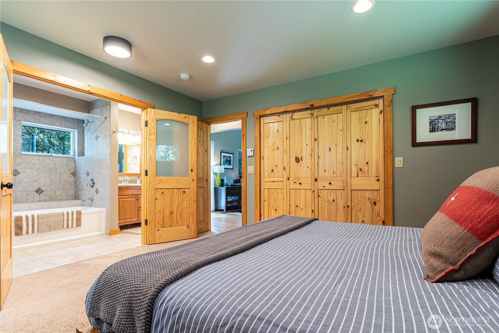 744 Tarte Road Friday Harbor, WA 98250 - Photo 17 of 35 a bedroom with a bed and a large window