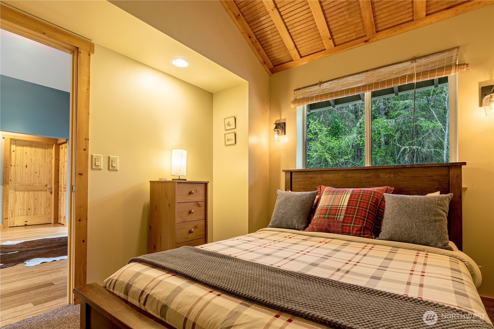 744 Tarte Road Friday Harbor, WA 98250 - Photo 18 of 35 a bedroom with a large bed and wooden floor