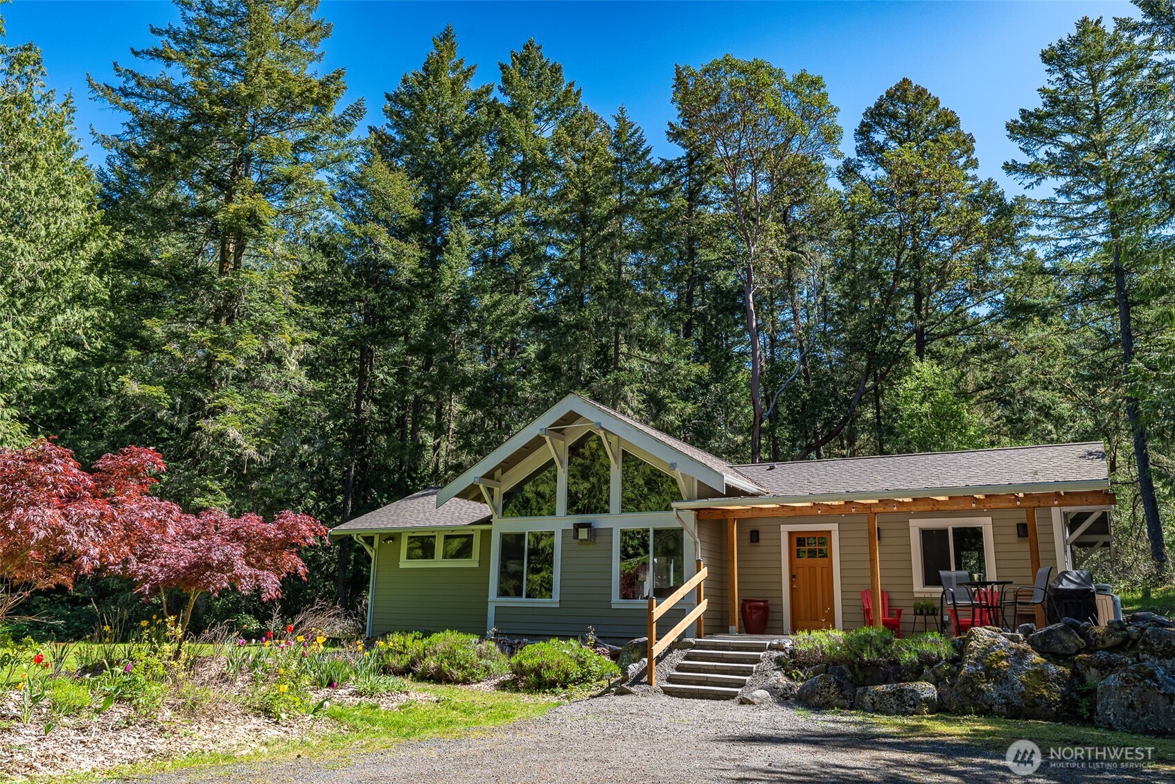 744 Tarte Road Friday Harbor, WA 98250 - Photo 3 of 35 a front view of a house with a yard and potted plants