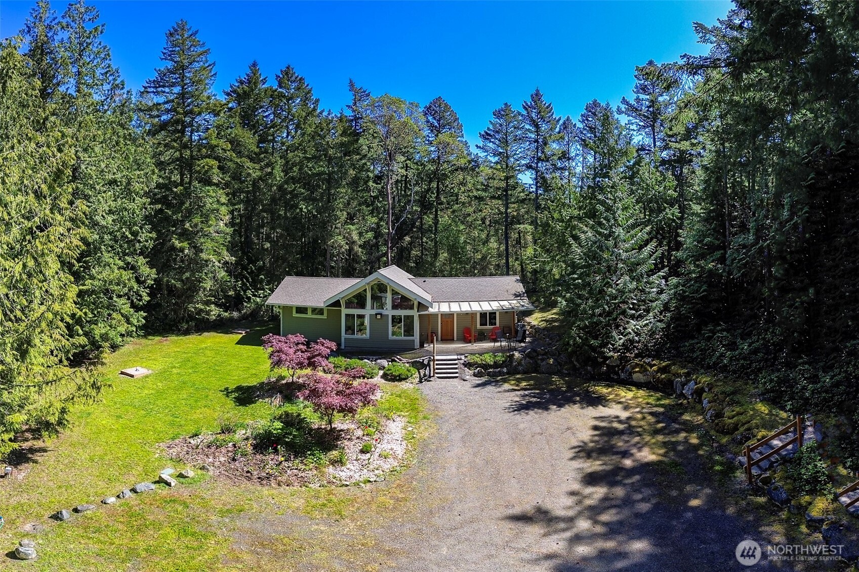 744 Tarte Road Friday Harbor, WA 98250 - Photo 32 of 35 a front view of a house with a yard and trees
